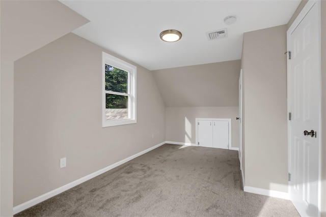 bonus room featuring carpet and lofted ceiling