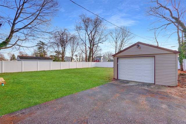 garage with a lawn