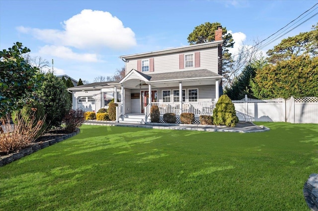 view of property with covered porch and a front yard