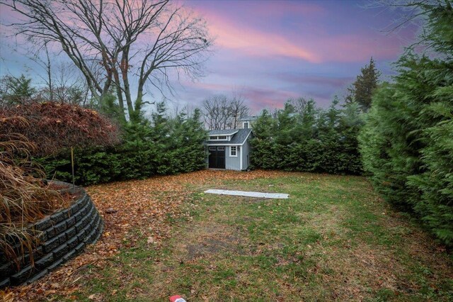 yard at dusk with a shed