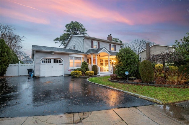 front of property with a garage