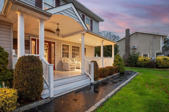 exterior space with a lawn and a porch