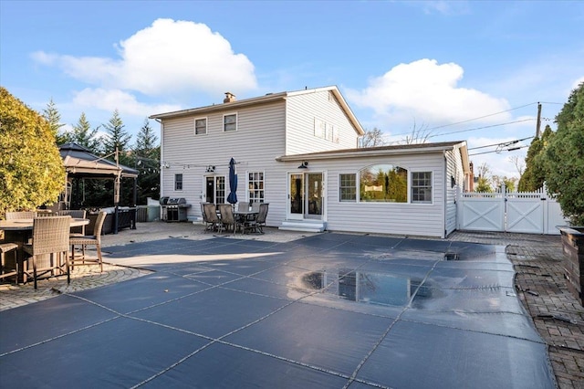 back of house with a patio