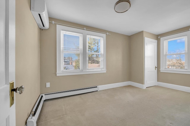 carpeted spare room featuring plenty of natural light, a wall mounted AC, and a baseboard heating unit