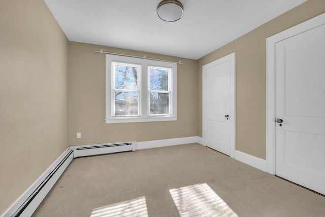 unfurnished bedroom with baseboard heating and light colored carpet