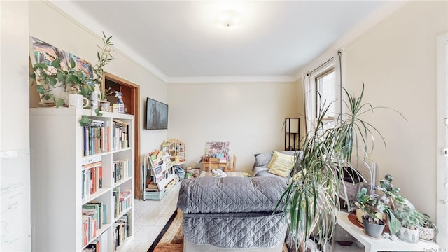 sitting room featuring crown molding and light tile patterned flooring