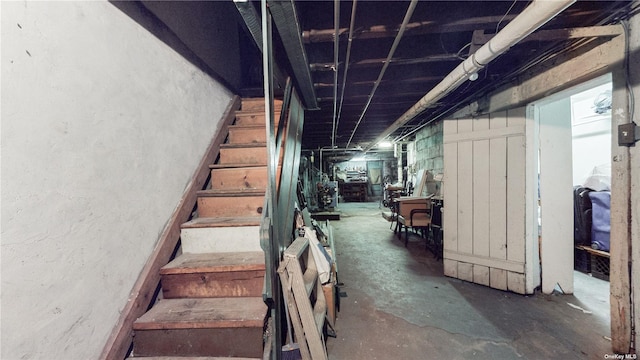 stairs featuring concrete floors