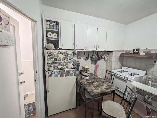 kitchen featuring white cabinetry, backsplash, white appliances, and range hood