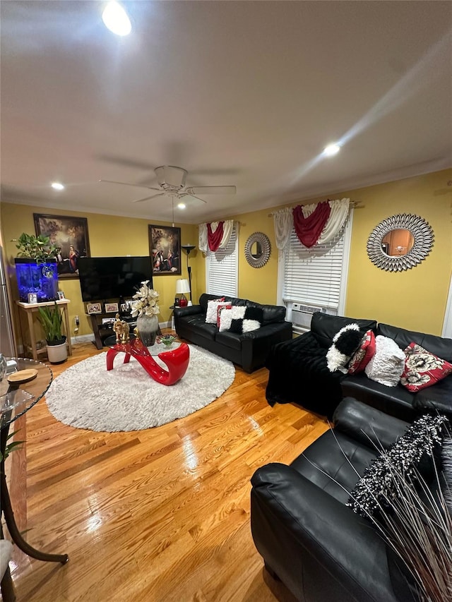 living room with hardwood / wood-style floors and ceiling fan