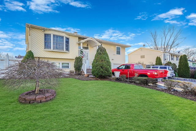 bi-level home with a front yard