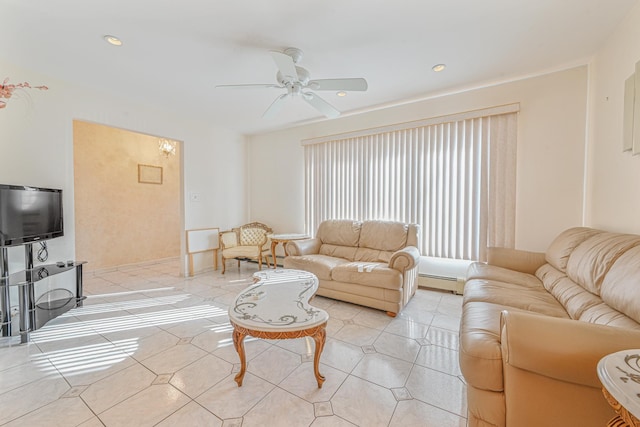 tiled living room with baseboard heating and ceiling fan