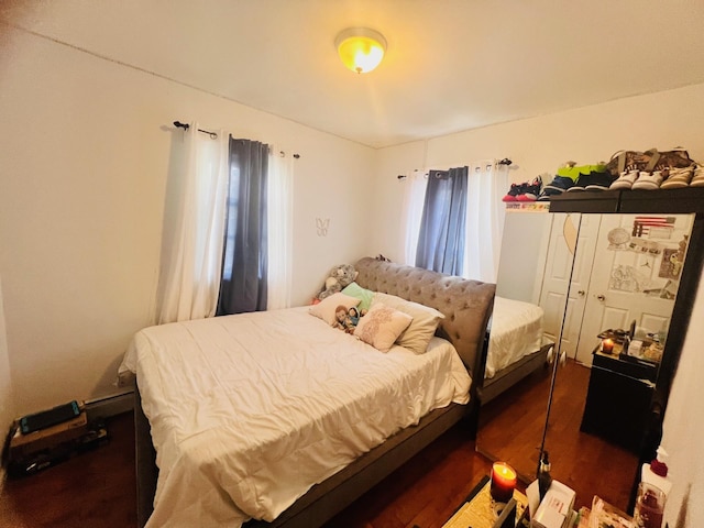 bedroom featuring dark hardwood / wood-style flooring