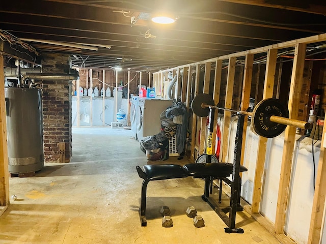 basement with washer and clothes dryer and gas water heater