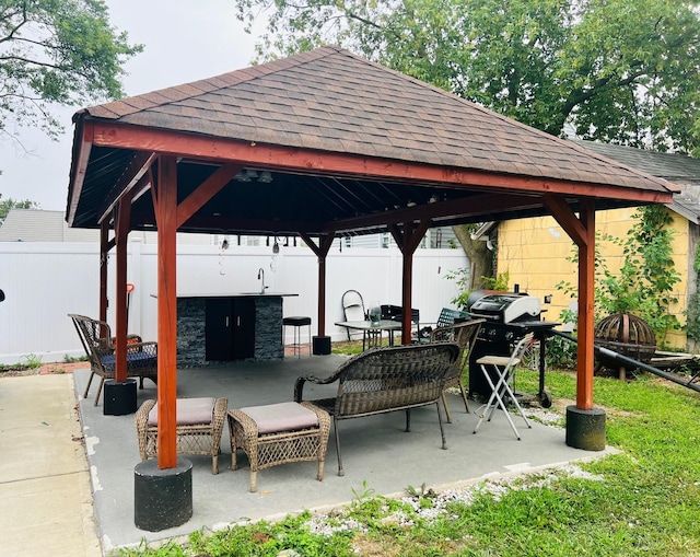 view of property's community featuring a gazebo and a patio