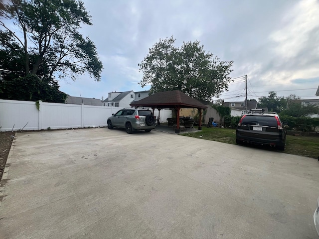 view of vehicle parking with a gazebo