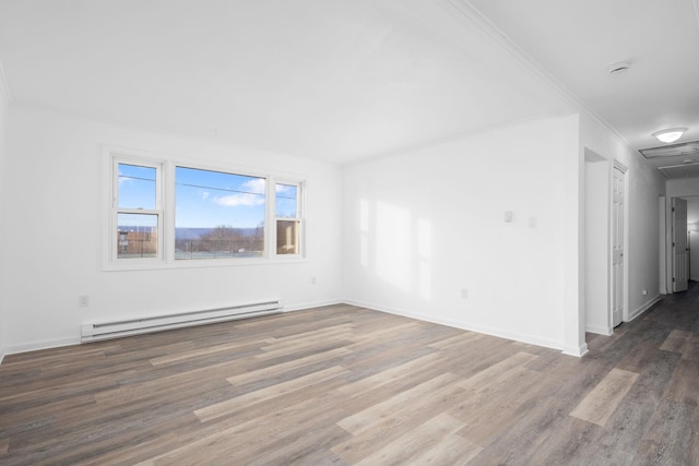 unfurnished room with dark hardwood / wood-style flooring, baseboard heating, and crown molding