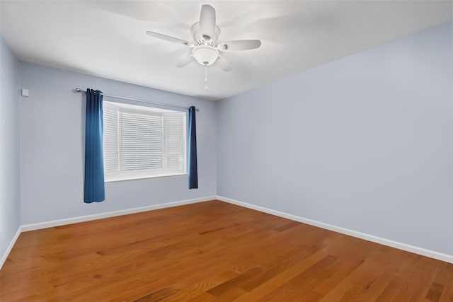 unfurnished room featuring hardwood / wood-style flooring and ceiling fan