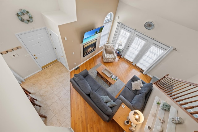 tiled living room with a high ceiling