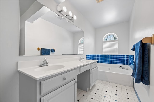 bathroom with vanity and a washtub