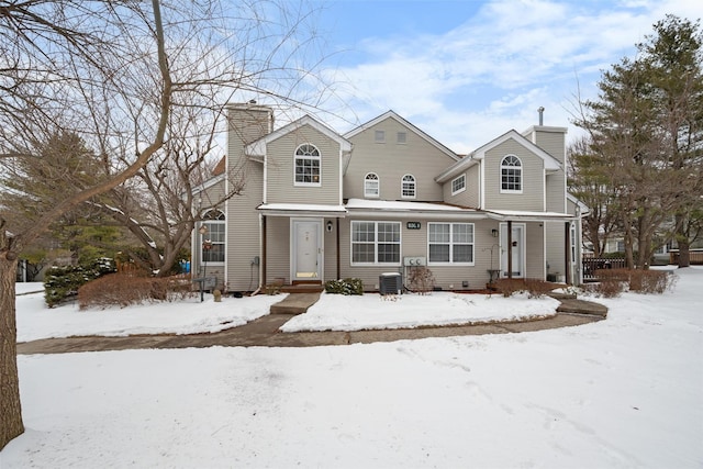 view of front property with central AC unit