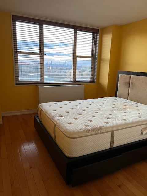 bedroom featuring dark wood-type flooring