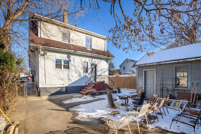 view of snow covered house