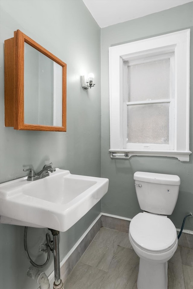 bathroom featuring sink and toilet