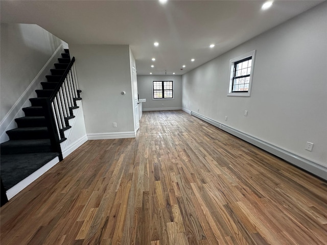 unfurnished living room with dark hardwood / wood-style floors