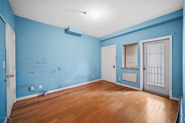 unfurnished bedroom featuring wood-type flooring