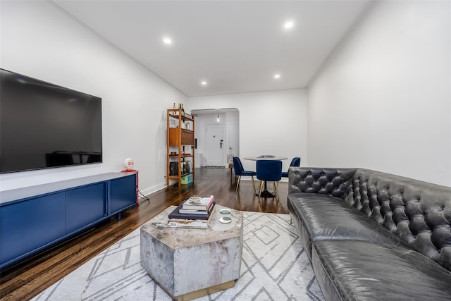 living room with dark hardwood / wood-style flooring