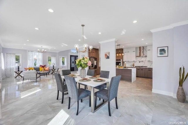 dining area with an inviting chandelier and crown molding