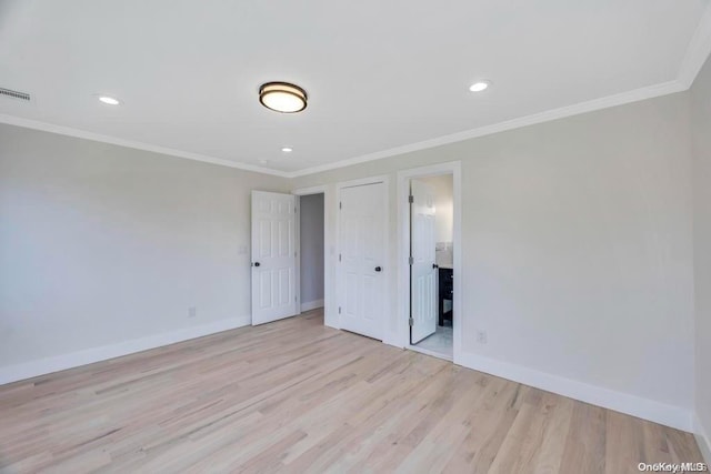 unfurnished bedroom featuring ornamental molding and light hardwood / wood-style flooring