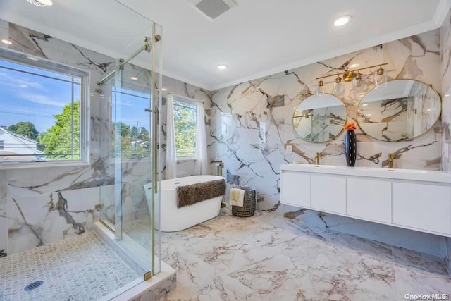 bathroom featuring crown molding, vanity, tile walls, and shower with separate bathtub