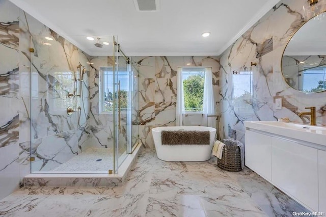 bathroom with vanity, crown molding, plus walk in shower, and tile walls