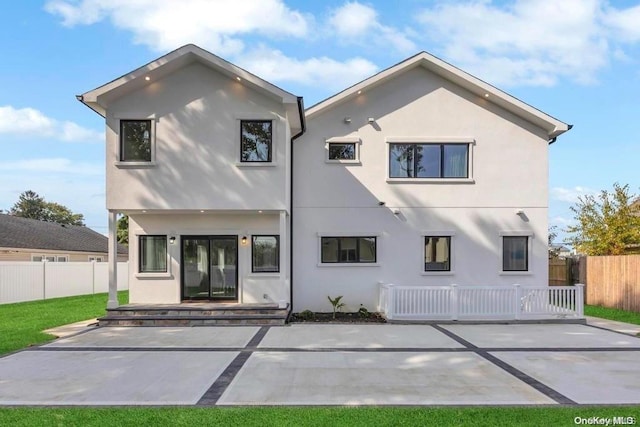 back of property featuring a patio