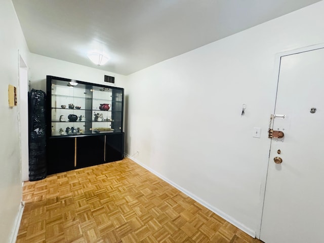 hall featuring parquet floors