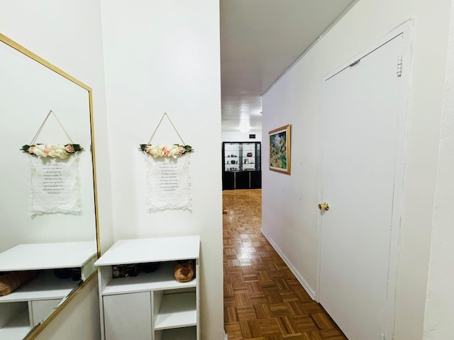 corridor with dark parquet flooring