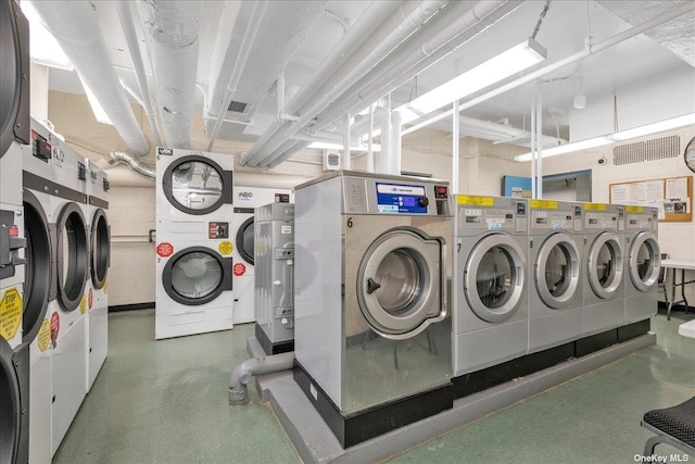 laundry area featuring washer and dryer and stacked washer and dryer