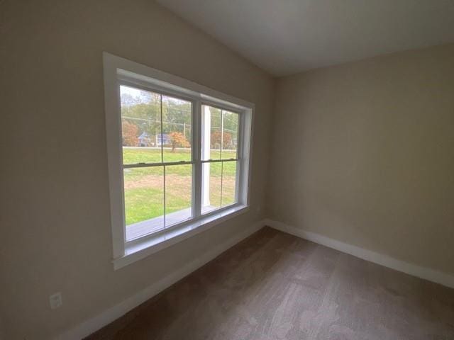 empty room with hardwood / wood-style floors