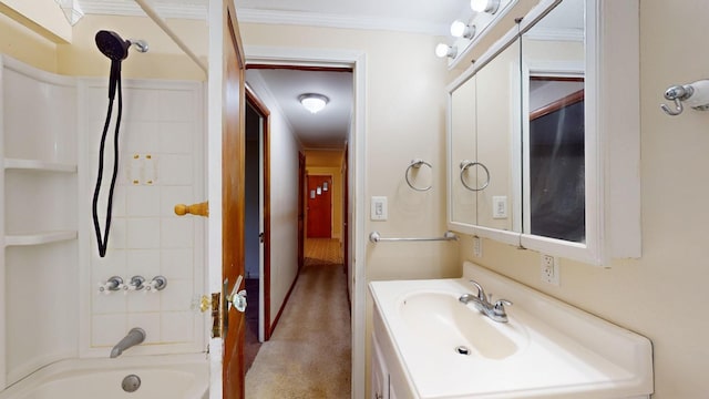 bathroom with tiled shower / bath, ornamental molding, and vanity