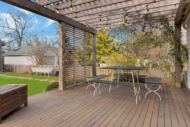 wooden deck featuring outdoor dining space, a pergola, a yard, and fence