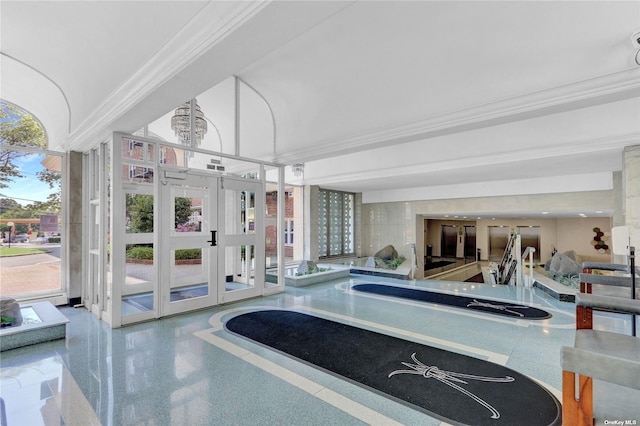 view of swimming pool featuring french doors