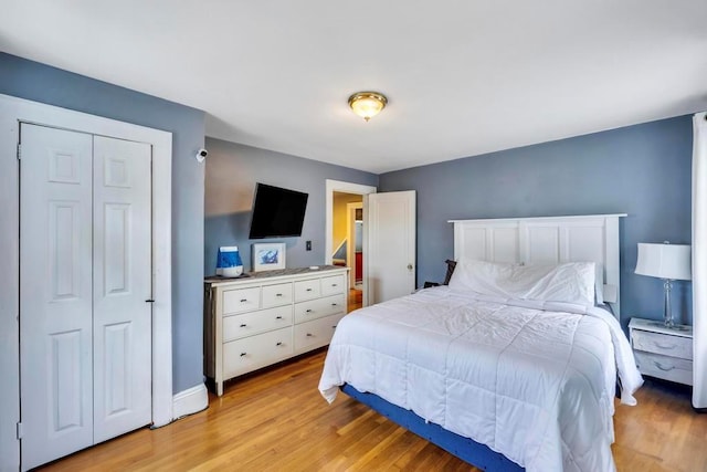 bedroom with light hardwood / wood-style flooring