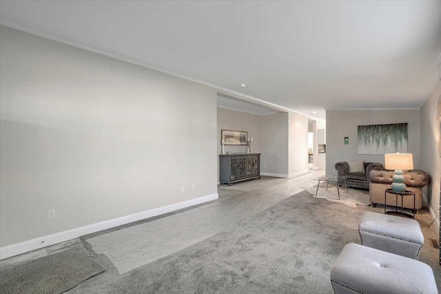 carpeted living room featuring crown molding