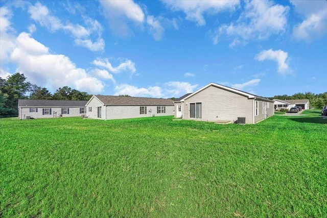 rear view of house with a lawn