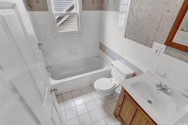 bathroom featuring decorative backsplash, tile patterned floors, vanity, tile walls, and toilet