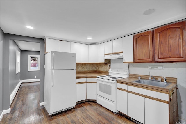 kitchen featuring sink, white cabinets, dark wood-type flooring, and white appliances