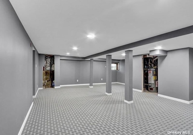 basement with water heater and carpet floors