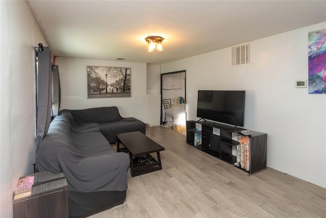 living room with light hardwood / wood-style floors