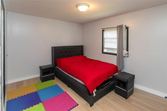 bedroom with wood-type flooring